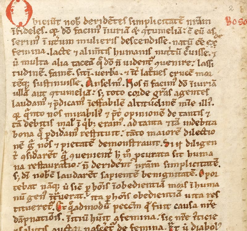 A page of a twelfth-century Latin manuscript in brown ink with red initials and the rubricated speaker labels Anselm and Boso.