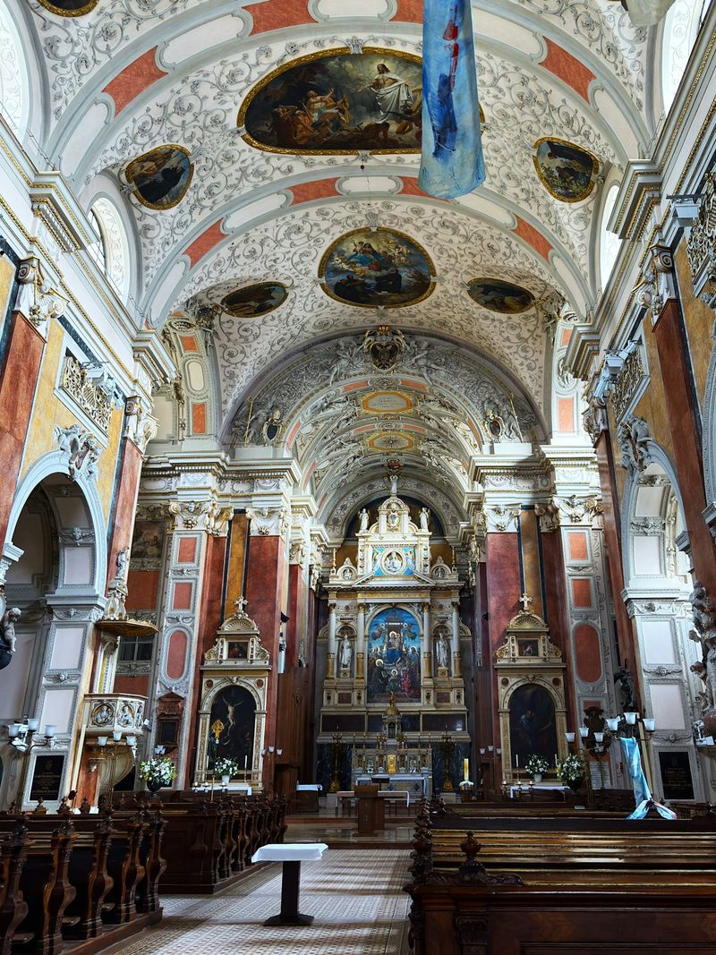 Interior of an ornate baroque Catholic church, reflecting the Counter-Reformation era in which the Molinist-Thomist debate took place