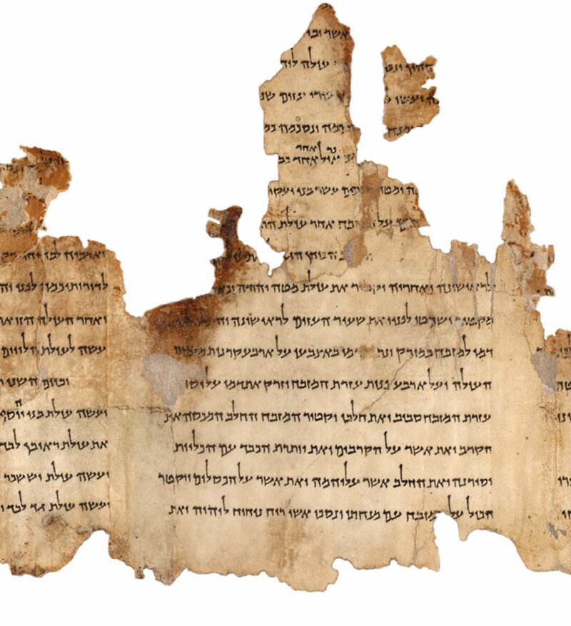 A Dead Sea Scroll manuscript fragment. The Community Rule (1QS) from Qumran uses explicit "sons of light / sons of darkness" covenantal language that resonates with John’s light-darkness imagery. Photo via Wikimedia Commons, public domain.
