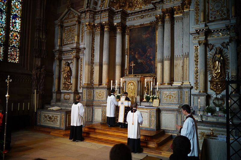 Priests in vestments celebrating the Tridentine Latin Mass ad orientem at the high altar of Strasbourg Cathedral