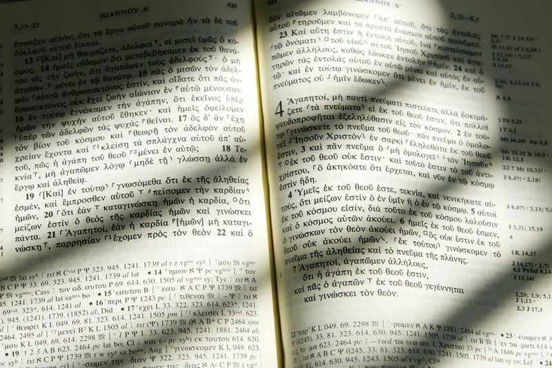 Open Greek New Testament showing parallel columns of Koine Greek text