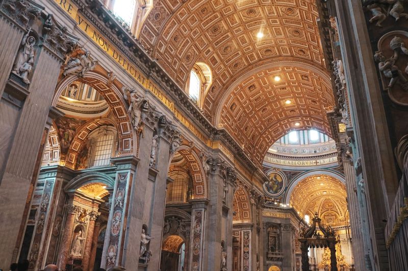 Golden vaulted interior of a grand basilica with ornate gilding and light streaming through the dome, evoking the golden-mouthed eloquence of John Chrysostom