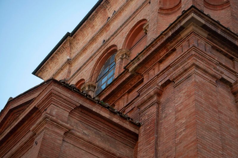 The brick facade of the Santuario della Madonna di San Luca on the hills above Bologna, Italy