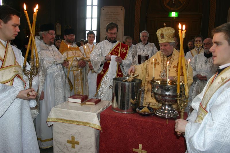 An Orthodox church calendar page showing feast days and icons of saints arranged according to the liturgical year.