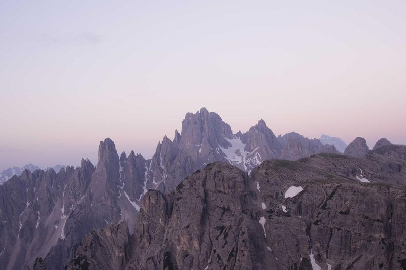 Mountain peaks at dusk, symbolizing the progressive stages of divine revelation from the Catechism of the Catholic Church